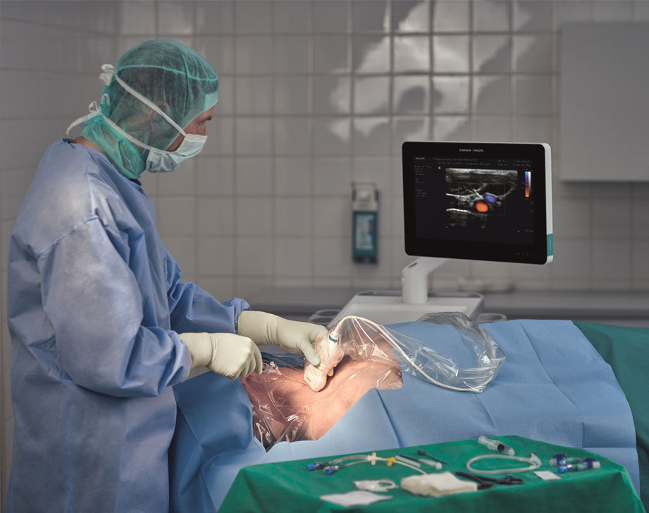 Đặt kim luồn tĩnh mạch có hỗ trợ của siêu âm do bác sĩ thực hiện khi bệnh nhân nằm 